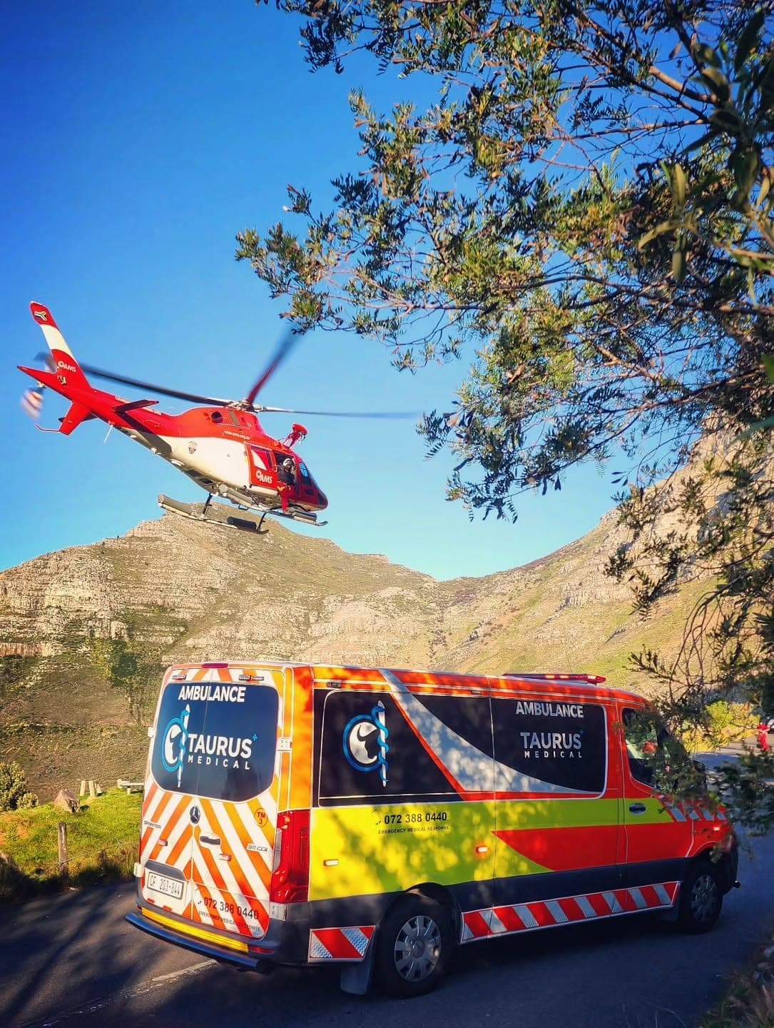 Taurus Medical ambulance on a mountain pass with an air ambulance coming in overhead